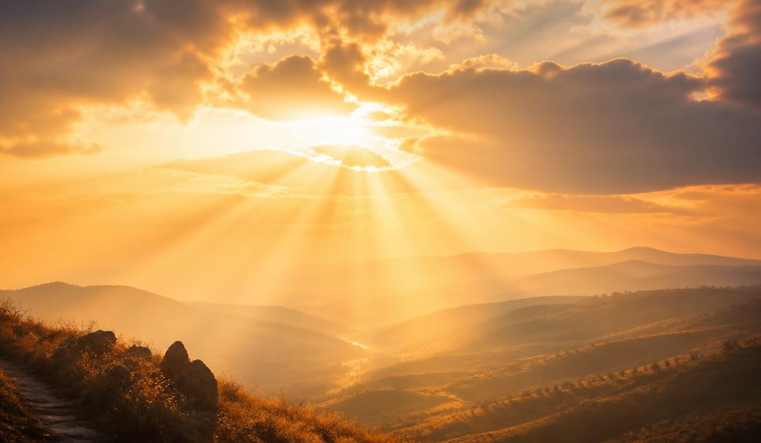 Warm sunlight breaking through clouds symbolizing hope and vision